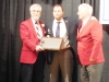 Enshrinee Christopher Dore, center, accepts his plaque from LSHOF President Tom Skoch, left and LSHOF Committee Member Neil Sommers