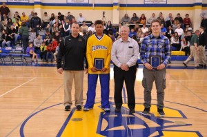 Clearview High School wide receiver Lance Billings, second from left, and quarterback Roger Engle, hold plaques from the Lorain Sports Hall of Fame honoring them for being named to the 2013 Associated Press Division IV All-Ohio First Team. Billings was named to the offense as an end and Engle punter. Clearview Athletic Director and football coach Mike Collier, left, and Lorain Sports Hall of Fame Committee President David Simpson made the presentation Dec. 20. Collier is also a LSHOF committee member. (Photo courtesy of Ed Thompson, ThomCat Photography) 