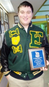 Tyler King is pictured with his plaque from the Sports Hall of Fame, which was presented to him at the LSHOF Museum in Lorain.