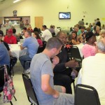 Guests socialize at the LSHOF Steak Fry Auyg. 3.