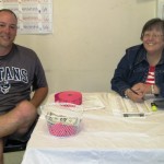 Bryan Koury and Bambi Dillon check in guests and sell 50-50 raffle tickets at the door.