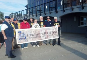 Members of the Lorain Sports Hall of Fame Committee, and friends, get ready to lead the Alumni Walk ceremony at the fourth Annual Lorain City Schools Homecoming Bonfire at Lakeview Beach on Sept. 25, 2014.